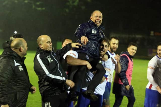 Andy Peaks is held aloft after AFC Rushden & Diamonds' promotion from the Evo-Stik South League East was confirmed last night. Pictures by Alison Bagley