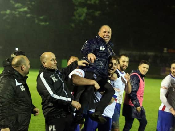 Andy Peaks is held aloft after AFC Rushden & Diamonds' promotion from the Evo-Stik South League East was confirmed last night. Pictures by Alison Bagley