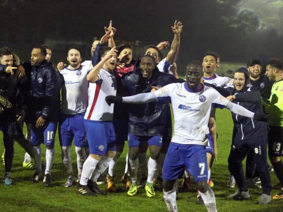 The AFC Rushden & Diamonds players celebrate promotion on the Hayden Road pitch after their 7-1 victory over Aylesbury FC on Tuesday night. Picture by Alison Bagley