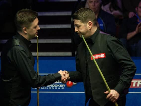 Kyren Wilson shakes hands with Matthew Stevens after the Kettering man cruised to a 10-3 victory in the first round of the World Championship. Picture by Tai Chengzhe/World Snooker