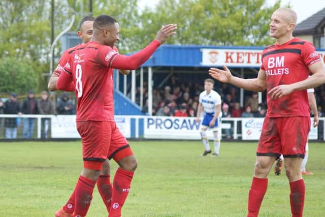 Aaron O'Connor celebrates his second goal with Rhys Hoenes and Lindon Meikle
