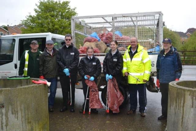Volunteers, including Cllr Martin Griffiths, getting stuck in with one of the litter picks