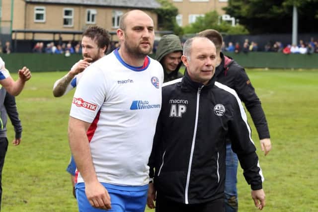 Captain Liam Dolman and boss Andy Peaks pictured following AFC Rushden & Diamonds' final game of their promotion-winning campaign. Picture by Alison Bagley