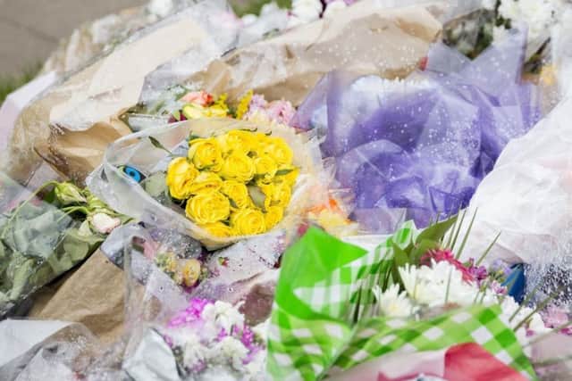 Floral tributes have been left at the scene.