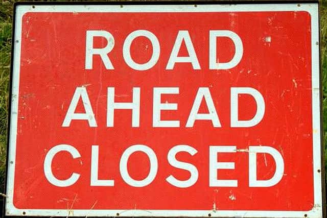Road Ahead Closed Sign