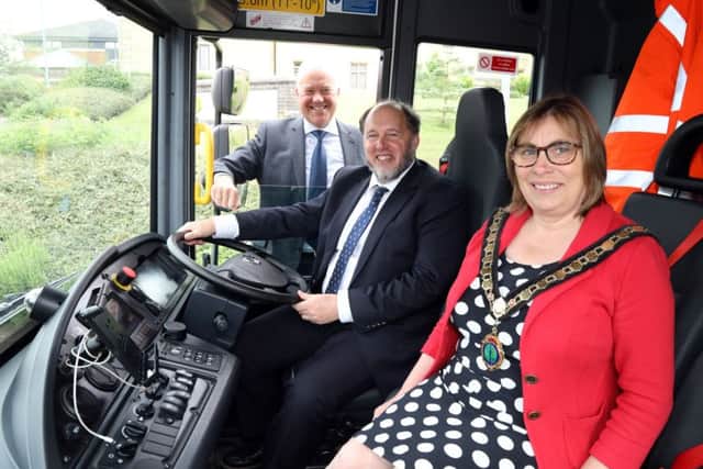 Council leader Steven North and ENC chairman Wendy Brackenbury inside one of the new waste vehicles