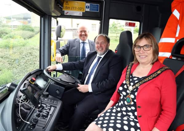 Council leader Steven North and ENC chairman Wendy Brackenbury inside one of the new waste vehicles