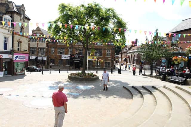 Police, fire and ambulance were called to help the woman in Market Street, Wellingborough