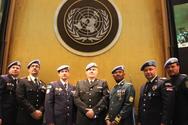 Chf Supt Simon Blatchly, OBE, (pictured centre) in the United Nations General Assembly Chamber