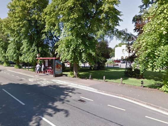 The woman was approached near the bus stop on East Park Parade, not far from the Medieval Fort restaurant.