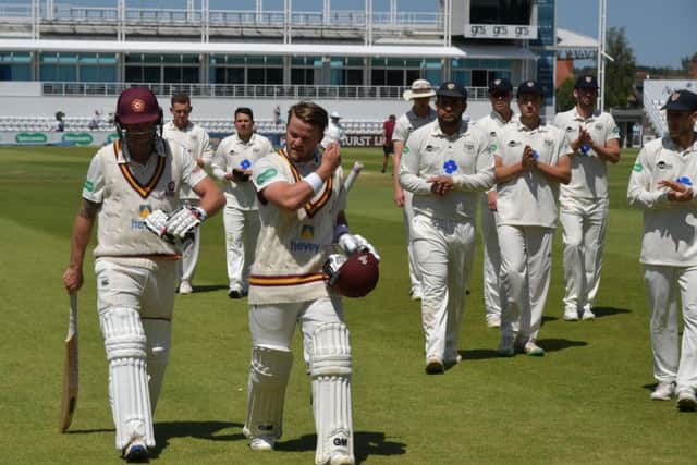 JOB DONE - Ben Duckett and Luke Procter leave the field after steering Northants to their 10-wicket win over Gloucestershire (Pictures: Dave Ikin)