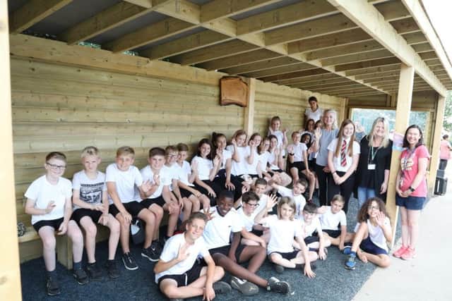 The official opening of the shelter with Year 6 children who were Niamh's classmates as well as Niamh's mum Sam and sister Hannah