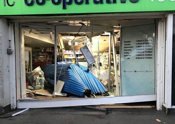 Damage caused after the first incident at the shop, a ram-raid, on Monday morning.
