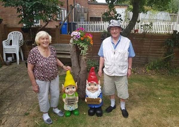 The couple with their new gnomes.
