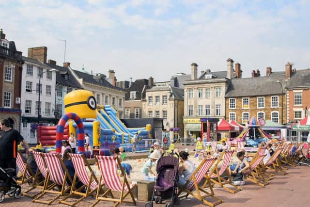 The giant sandpit is currently set up in Northampton's Market Square for little one's to use during six-weeks of no term time.