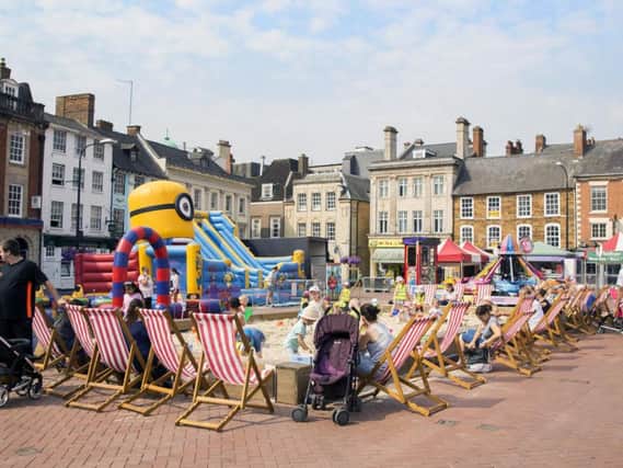 The giant sandpit is currently set up in Northampton's Market Square for little one's to use during six-weeks of no term time.