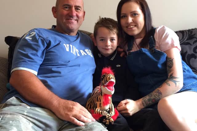 Five-year-old Riley sprang into action when his mum Megan fell to the floor. Grandad Kevin (right) says he is a "little superhero".