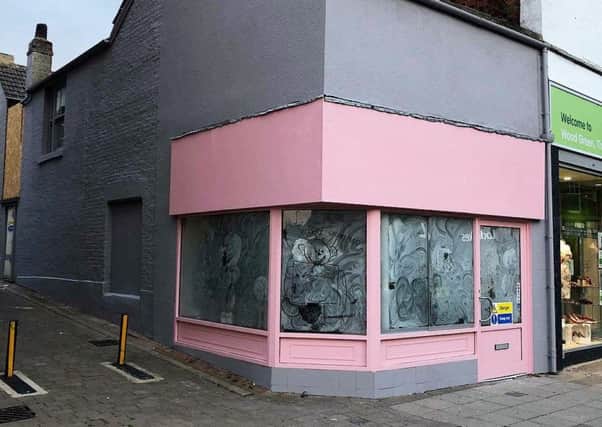 The shop's bright pink facade.