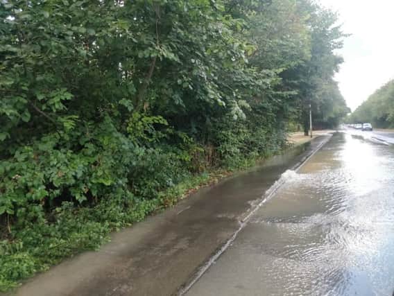 The burst water main in Rockingham Road, Corby. NNL-180814-155141005
