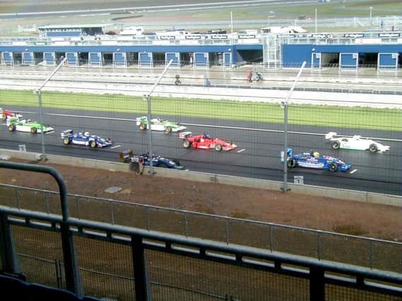 2005: The blue Jensen Motorsport cars line up on the Rockingham grid: right to left - Pete Le Bas, Wayne Clark and Ricky Cole. MAYOAK0002939040