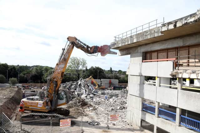 An 83-tonne machine is ripping apart the former multi-storey car park in Corby