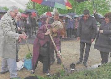 Cllr Emerson (left) at the planting of the roses