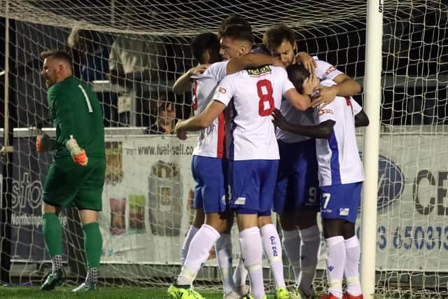 AFC Rushden & Diamonds celebrate Tom Lorraine's opening goal in the 3-0 success over Deeping Rangers. Pictures by Alison Bagley