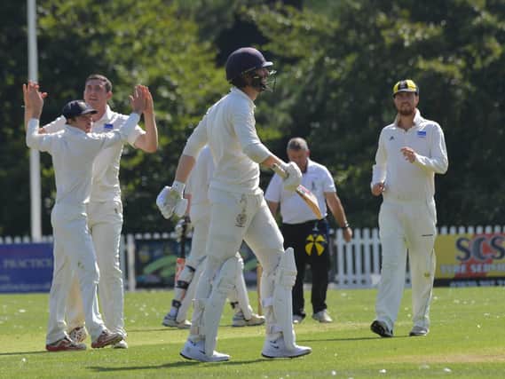 Finedon Dolben celebrate after Jack Chopping trapped Brixworths John Bowers leg before during the Premier Division leaders six-wicket victory last weekend. Picture by Dave Ikin