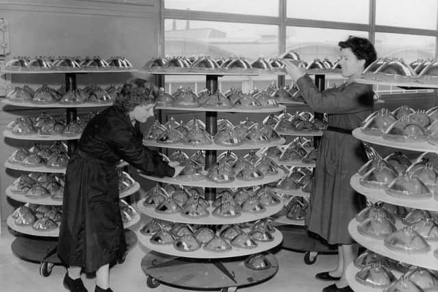 Car headlamps being produced at the new Â£500,000 British Sealed Beams factory. One of the first pictures taken in the factory shows Ellen Bindley and Eleanor Savage stacking up the lamps as they come off the assembly line. It was hoped that the factory would employ 400 people, mostly women.