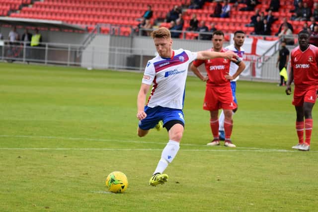 Ben Farrell steps up to score from the penalty spot but it proved to be only a consolation for AFC Rushden & Diamonds. Picture courtesy of HawkinsImages