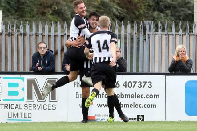 Elliot Sandy celebrates with Joel Carta after the latter grabbed the Steelmen's second goal in their FA Cup success. Pictures by Alison Bagley