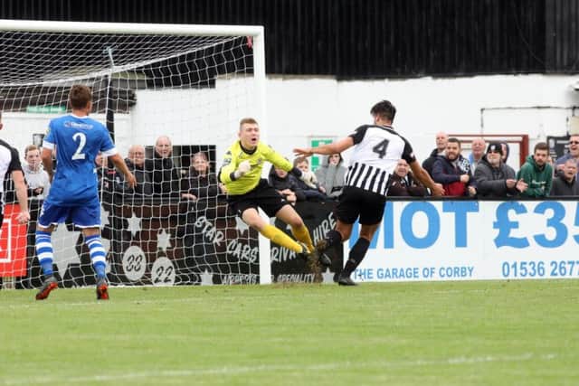 Joel Carta scores Corby's second goal in their victory over Hertford Town