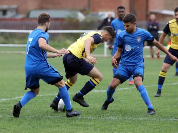 Action from the 2-2 draw between Desborough Town and Whitworth. Pictures by Alison Bagley