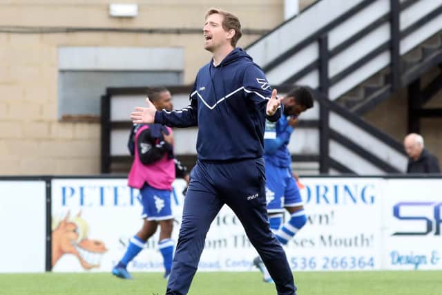 Corby Town manager Steve Kinniburgh shows his delight at the final whiste after his team beat Hertford Town 2-0 in the Emirates FA Cup. Pictures by Alison Bagley