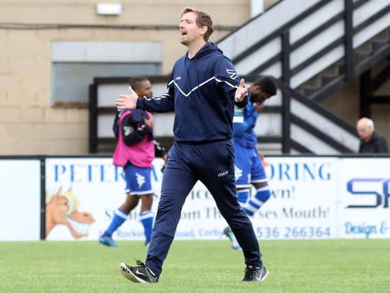 Corby Town manager Steve Kinniburgh shows his delight at the final whiste after his team beat Hertford Town 2-0 in the Emirates FA Cup. Pictures by Alison Bagley