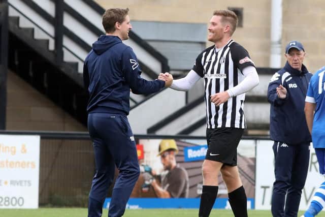 Boss Steve Kinniburgh and striker Elliot Sandy enjoy the moment after Corby Town's FA Cup success over Hertford Town. Picture by Alison Bagley