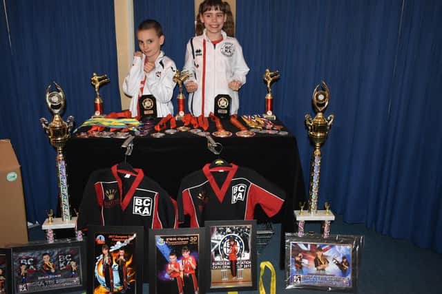 Harlee and Keris Hooker showed off their medals and trophies as they held a quiz night at Desborough Cons back in April to help them pursue their World Championship dream