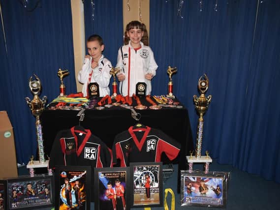 Harlee and Keris Hooker showed off their medals and trophies as they held a quiz night at Desborough Cons back in April to help them pursue their World Championship dream