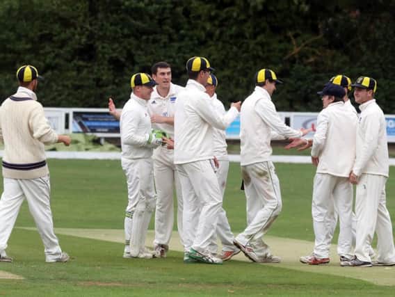 Finedon Dolben celebrate a wicket during last weekend's win over Peterborough as they closed in on the NCL Premier Division title. Picture by Alison Bagley