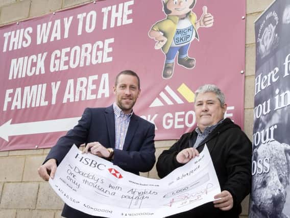 Paul Scully-Sloan (right) is handed the cheque (picture: Kirsty Edmonds)