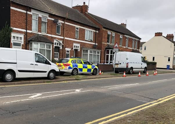 The scene in Windmill Avenue in Kettering this morning after a double stabbing. NNL-180917-125732005