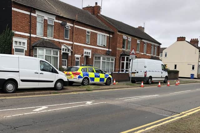 The scene in Windmill Avenue in Kettering this morning after a double stabbing. NNL-180917-125732005