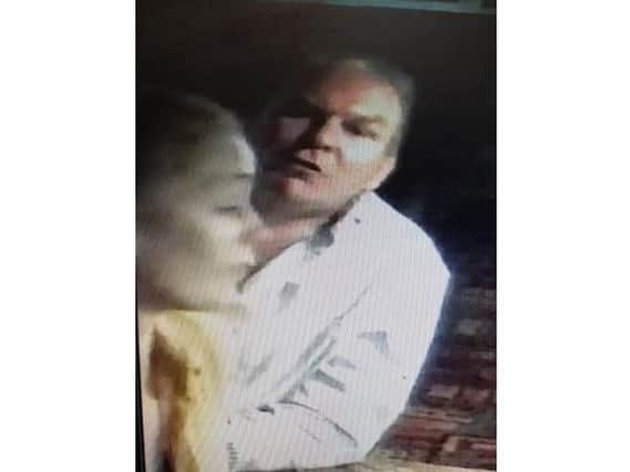 Police want to speak to this man in connection with a racially aggravated assault at a Northampton pub.