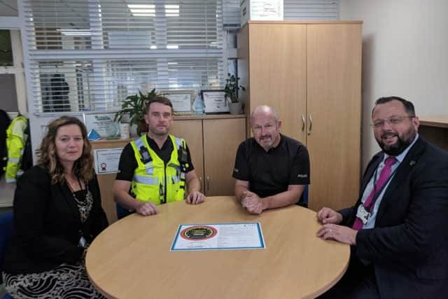Members of the police and Corby Council with the pledge. NNL-180920-110546005