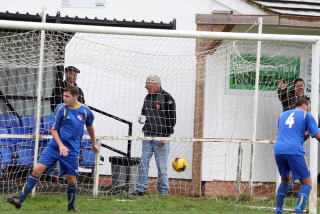 The ball is in the net for Irchester's winner against Sileby