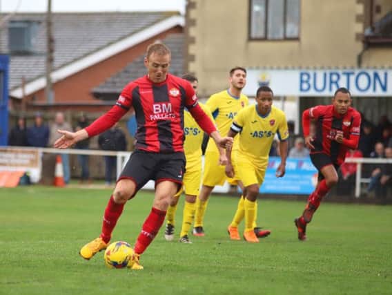 Brett Solkhon scores from the penalty spot to give Kettering Town the lead in the 2-1 victory over AFC Mansfield at Latimer Park. Pictures by Peter Short