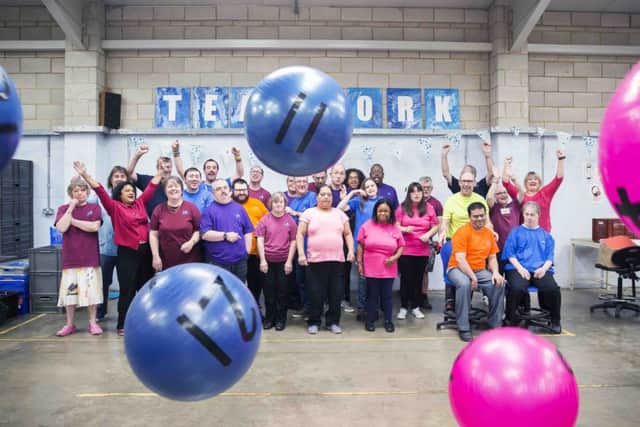 Teamwork Trust members and staff celebrate their Lottery award