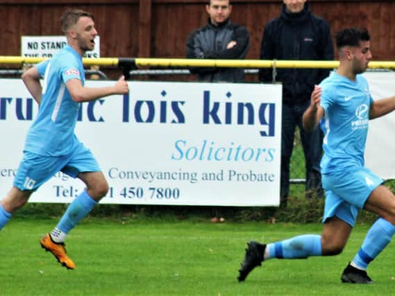 Joel Carta celebrates one of his three goals in Corby Town's FA Cup win at Alvechurch last weekend. Picture by David Tilley