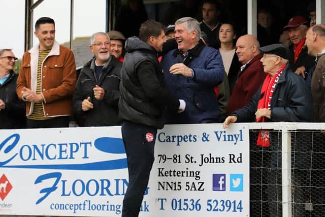 Kettering Town manager Marcus Law shares a joke with club legend and record appearance holder Roger Ashby ahead of last weekend's FA Cup victory over AFC Mansfield. Picture by Peter Short