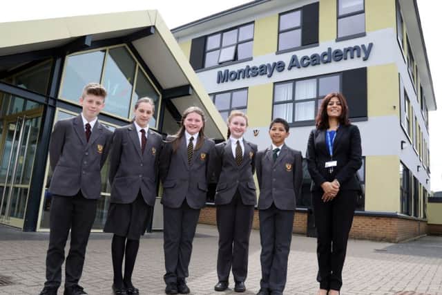 Improving School: Rothwell: Montsaye Academy, head teacher Meena Gabbi with pupils.